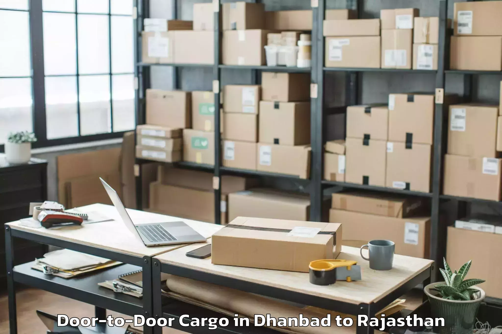 Dhanbad to Iihmr University Jaipur Door To Door Cargo Booking